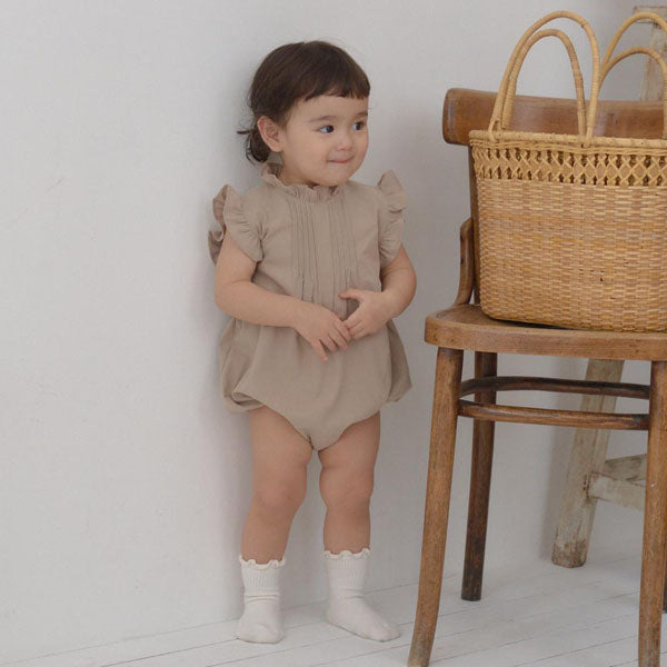 B Betty Ruffle Bodysuit Korean infant bodysuit in black made in Korea